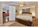Bedroom with tiled floors, ceiling fan and access to the living room at 2848 Homewood St, Clearwater, FL 33759