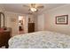 Well lit bedroom featuring tile floors, dresser and private bathroom at 2848 Homewood St, Clearwater, FL 33759