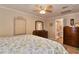 Cozy bedroom featuring tile floors, a ceiling fan, and a dresser at 2848 Homewood St, Clearwater, FL 33759