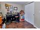 A room features a work station, closet doors, and dark wood flooring at 2848 Homewood St, Clearwater, FL 33759