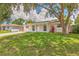 Delightful home with a lush front yard, providing ample space and curb appeal at 2848 Homewood St, Clearwater, FL 33759