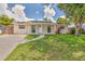 Charming single-story home with well-maintained lawn and a welcoming walkway to the front door at 2848 Homewood St, Clearwater, FL 33759