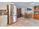 Open kitchen with stainless steel appliances, tile flooring, and breakfast nook at 2848 Homewood St, Clearwater, FL 33759