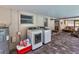 An enclosed patio features a washer and dryer with wicker furniture in the background at 2848 Homewood St, Clearwater, FL 33759