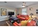 Comfortable living room featuring leather seating and a ceiling fan at 2848 Homewood St, Clearwater, FL 33759