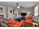 Cozy living room with leather seating, ceiling fan, and elegant decor at 2848 Homewood St, Clearwater, FL 33759