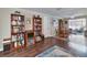 Open living room with bookcases leading to an outdoor living space at 2848 Homewood St, Clearwater, FL 33759