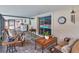 An enclosed patio features wicker furniture with views of the backyard pool at 2848 Homewood St, Clearwater, FL 33759