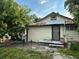 Backyard of home with trees, including a mango tree at 2909 N 11Th St, Tampa, FL 33605