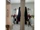 View of bathroom with a toilet, vanity, mirror and black and white checkered walls at 2909 N 11Th St, Tampa, FL 33605