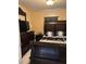 Bedroom featuring a large, ornate bed frame and a television at 2909 N 11Th St, Tampa, FL 33605