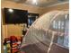 Bedroom with a television, closet, and mosquito net over the bed at 2909 N 11Th St, Tampa, FL 33605