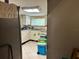 Functional kitchen with white cabinets, appliances, and natural light at 2909 N 11Th St, Tampa, FL 33605