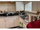 Functional kitchen with white appliances, and overhead cabinets at 2909 N 11Th St, Tampa, FL 33605