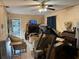 Cozy living room featuring tile floors, ceiling fan, and vintage furniture at 2909 N 11Th St, Tampa, FL 33605