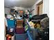 Overflowing storage space filled with containers and boxes, highlighting the home's storage capacity at 2909 N 11Th St, Tampa, FL 33605