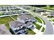 Aerial view of the property showcasing well-kept lawn, white fence, and suburban neighborhood at 29245 Fedora Cir, Brooksville, FL 34602
