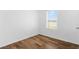 Inviting bedroom with natural light, wood-look floors, and a serene ambiance for relaxation and comfort at 29245 Fedora Cir, Brooksville, FL 34602