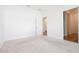 Bright bedroom with plush carpet and an ensuite bathroom at 29245 Fedora Cir, Brooksville, FL 34602