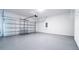 Clean, spacious two-car garage with sealed concrete floor, perfect for parking and storage at 29245 Fedora Cir, Brooksville, FL 34602