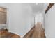 Spacious hallway leads to the bathroom, complete with sleek flooring and contemporary design for easy navigation at 29245 Fedora Cir, Brooksville, FL 34602