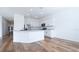 Open-concept kitchen with stainless steel appliances and a granite countertop island at 29245 Fedora Cir, Brooksville, FL 34602