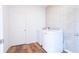 Functional laundry room equipped with modern washer and dryer, set against a stylish accent wall at 29245 Fedora Cir, Brooksville, FL 34602