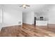 Open-concept living room with modern finishes, wood-look floors, and recessed lighting at 29245 Fedora Cir, Brooksville, FL 34602