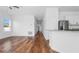 Bright living room showcasing wood-look floors and an open-concept layout at 29245 Fedora Cir, Brooksville, FL 34602