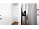 Spacious pantry with shelving next to stainless steel refrigerator at 29245 Fedora Cir, Brooksville, FL 34602