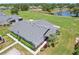 Beautiful aerial view showcasing the new roof, manicured landscaping, and inviting curb appeal of this lovely property at 301 Canton Ct # 77, Sun City Center, FL 33573