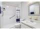 Bathroom featuring accessible shower with grab bars, a white vanity, and modern fixtures at 301 Canton Ct # 77, Sun City Center, FL 33573