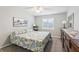 Bright bedroom featuring double window blinds and dresser at 301 Canton Ct # 77, Sun City Center, FL 33573