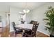Charming dining area featuring a round table, chandelier, and hardwood floors at 301 Canton Ct # 77, Sun City Center, FL 33573