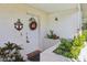 A charming front door with seasonal wreath and decorative nautical welcome sign at 301 Canton Ct # 77, Sun City Center, FL 33573