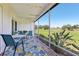 Relaxing lanai with outdoor furniture overlooking the backyard at 301 Canton Ct # 77, Sun City Center, FL 33573