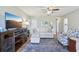Stylish living room with a modern television, comfortable seating, and a decorative rug at 301 Canton Ct # 77, Sun City Center, FL 33573