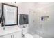 Bathroom featuring a glass enclosed shower, white vanity, and modern fixtures at 3603 Tour Trce, Land O Lakes, FL 34638