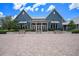 Stunning clubhouse showcasing a symmetrical design with a welcoming entrance and beautifully paved courtyard at 3603 Tour Trce, Land O Lakes, FL 34638