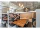Cozy dining nook showcasing decorative paisley booths, ambient pendant lighting, and comfortable seating at 3603 Tour Trce, Land O Lakes, FL 34638