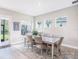 Cozy dining room featuring a table with six chairs and views of the backyard at 3603 Tour Trce, Land O Lakes, FL 34638