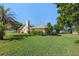 Spacious backyard with well-maintained lawn and view of house exterior at 4355 Odin St, Spring Hill, FL 34608