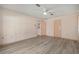 Bedroom featuring light walls, modern flooring, and standard door at 4355 Odin St, Spring Hill, FL 34608