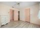 Cozy bedroom with wood-look flooring, ceiling fan, and neutral tones at 4355 Odin St, Spring Hill, FL 34608