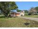 Charming single-story home with a lush lawn and mature trees in a quiet neighborhood at 4355 Odin St, Spring Hill, FL 34608