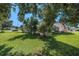 Charming single-story home featuring a screened porch and spacious, well-maintained lawn at 4355 Odin St, Spring Hill, FL 34608