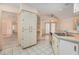 Bright kitchen with white cabinetry, stainless steel sink, and eat-in nook at 4355 Odin St, Spring Hill, FL 34608