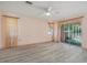 Spacious main bedroom with sliding glass doors to the backyard and plush neutral carpeting at 4355 Odin St, Spring Hill, FL 34608