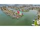 Panoramic aerial view of waterfront home with boat docks on a scenic peninsula at 442 Midway Is, Clearwater Beach, FL 33767