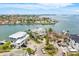 Desirable waterfront estate features manicured lawns, circular drive, and exquisite detail at 442 Midway Is, Clearwater Beach, FL 33767